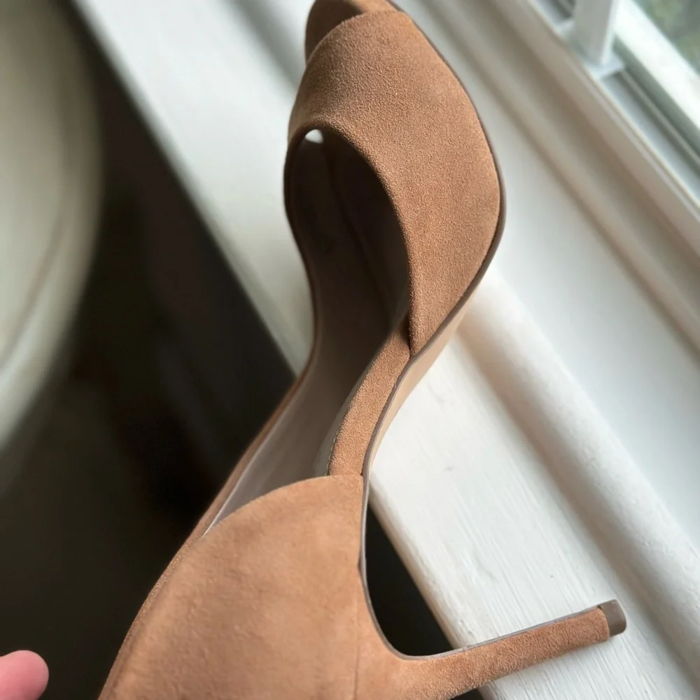 Neiman Marcus tan suede peep toe pumps.
